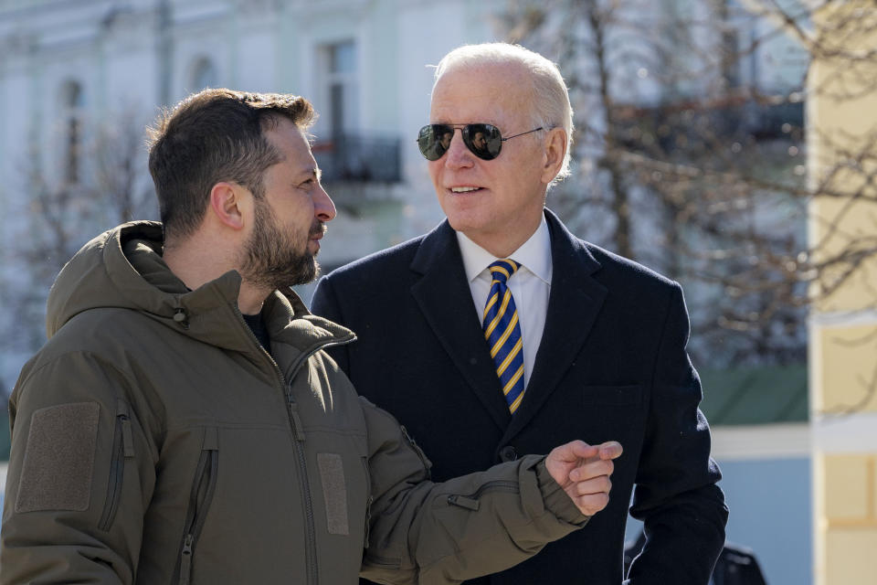 President Joe Biden, right, and Ukrainian President Volodymyr Zelenskyy talk during an unannounced visit in Kyiv, Ukraine, Monday, Feb. 20, 2023. (Ukrainian Presidential Press Office via AP)