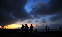 <p>Locals enjoy sunset after the passage of Hurricane Irma, in Cojimar neighborhood in Havana, on Sept. 10, 2017. (Photo: Yamil Lage/AFP/Getty Images) </p>