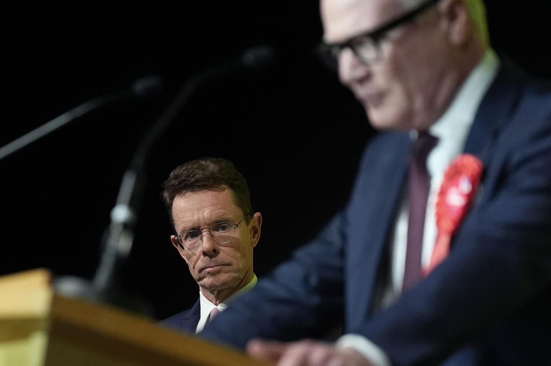 Defeated Conservative Andy Street, left, listens to Labour's Richard Parker as he is elected the new West Midlands mayor. (PA)