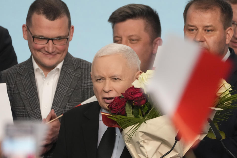 Conservative Law and Justice party leader Jaroslaw Kaczynski, centre, declared victory in Poland's local and regional elections in Warsaw, Poland, on Sunday, April 7, 2024. The exit polls have a small margin of error and final results are not expected until Monday. The vote is the first test at the ballot box for Prime Minister Donald Tusk four months after he took office. (AP Photo/Czarek Sokolowski)