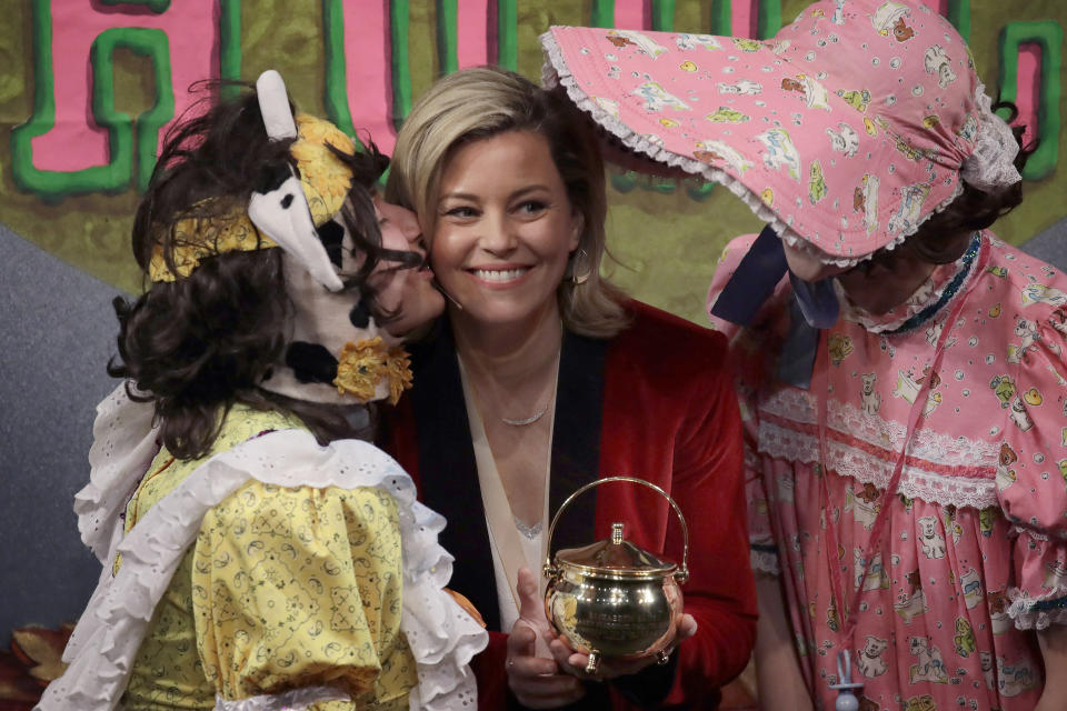 Actor and director Elizabeth Banks receives a Pudding Pot onstage as she is honored as the 2020 Woman of the Year by Harvard University's Hasty Pudding Theatricals, Friday, Jan. 31, 2020, in Cambridge, Mass. (AP Photo/Elise Amendola)