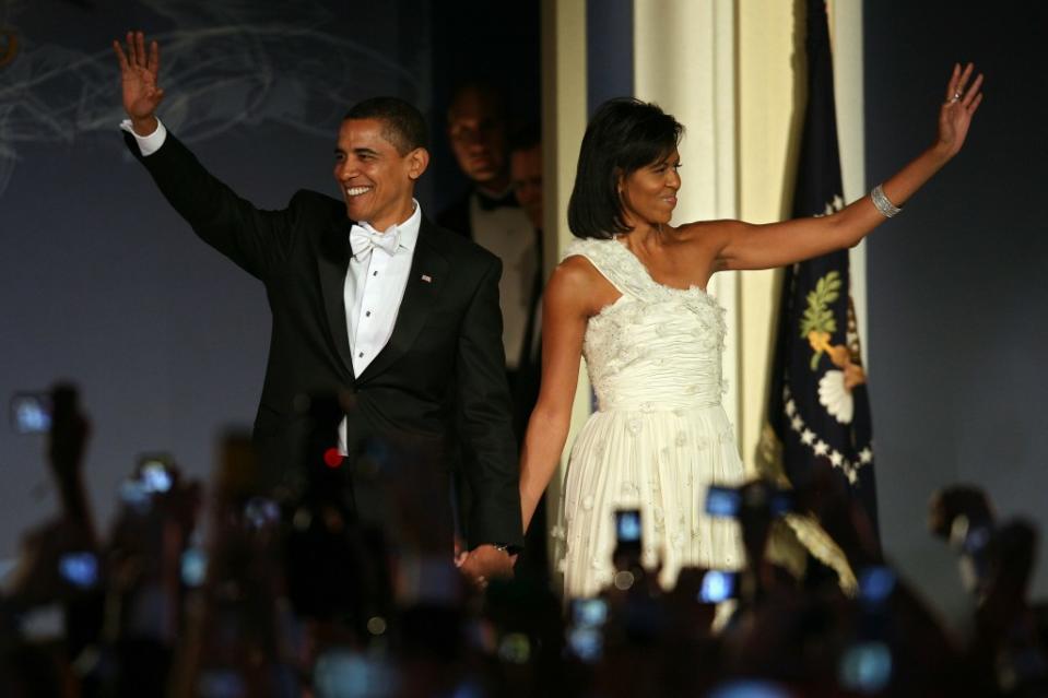 U.S President Barack Obama and his wife First Lady Michelle Obama arrive on stage during MTV & ServiceNation: Live From The Youth Inaugural Ball at the Hilton Washington on January 20, 2009 in Washington, DC. (Photo by Abby Brack/Getty Images)