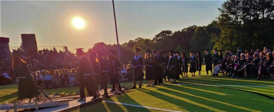 The sun gets ready to set on the high school lives of the Class of 2023 at East Henderson High School on June 9 during the graduation ceremony.