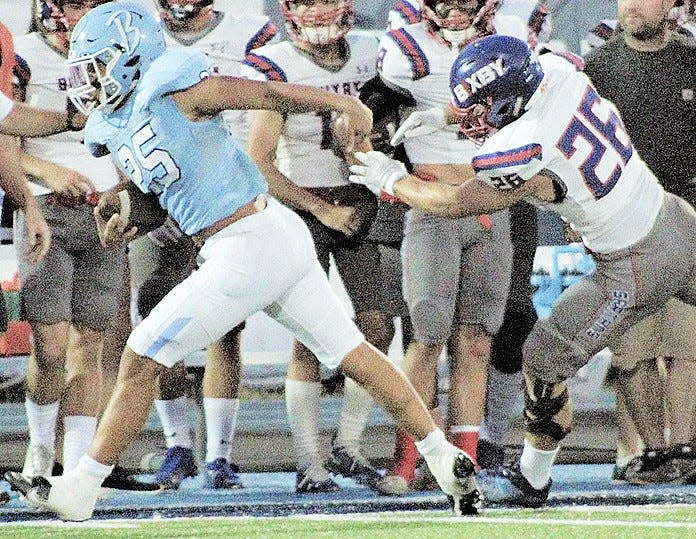 Bartlesville High's P.J. Wallace breaks away from a Bixby defender during grid action in 2021.