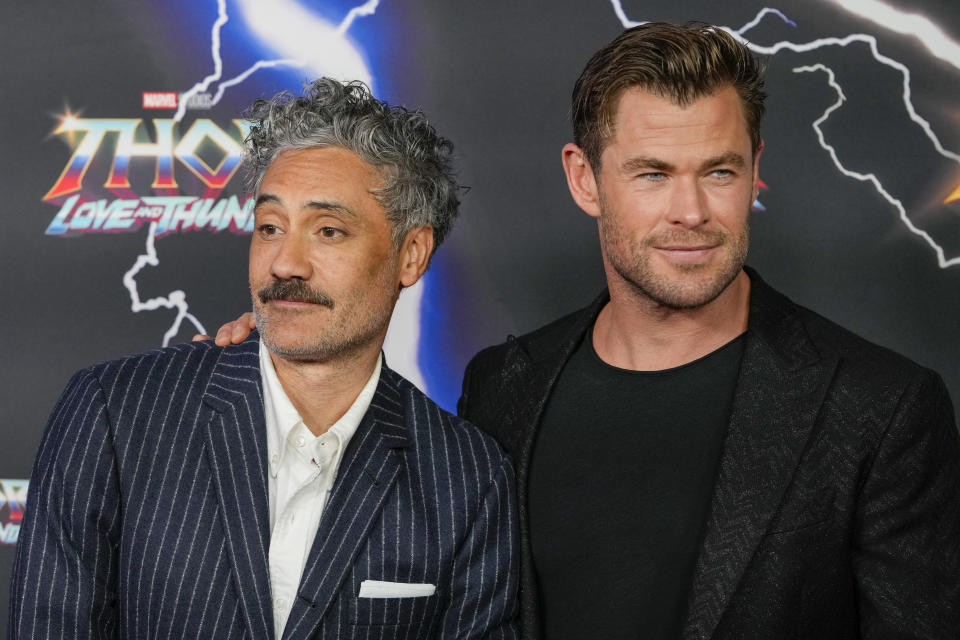 Australian actor Chris Hemsworth, right, and New Zealand director Taika Waititi pose for a photo during a red carpet event for the movie premiere of "Thor: Love and Thunder" at the Entertainment Quarter in Sydney,Australia, Monday, June 27, 2022.(AP Photo/Mark Baker)