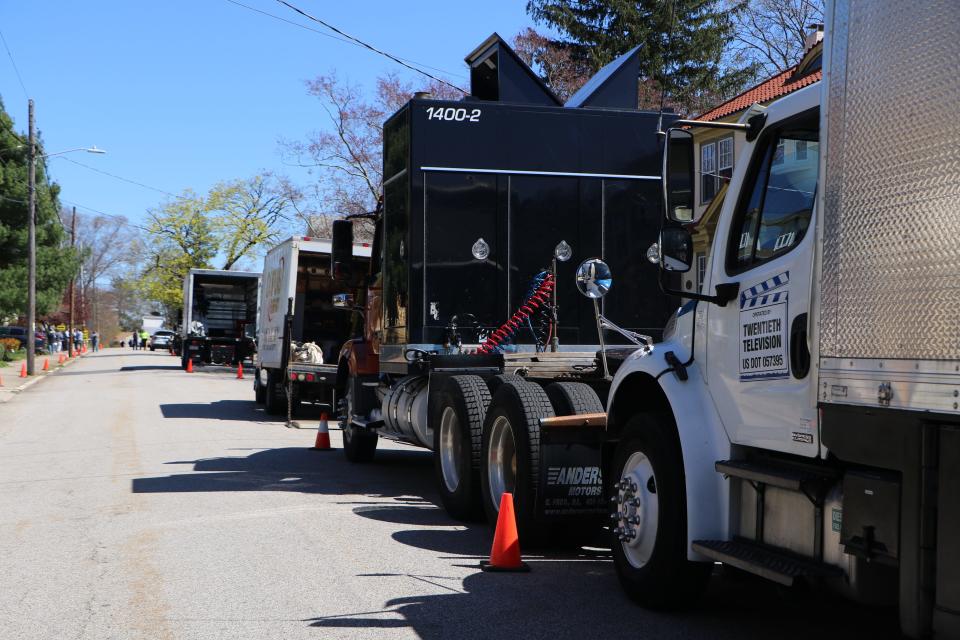 Movie production trucks line Glenwood Avenue in Pawtucket on Monday afternoon. [Paul Edward Parker/The Providence Journal]