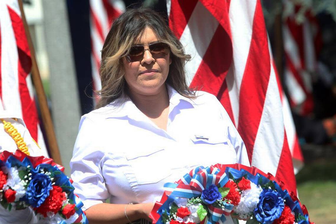 Madera County Supervisor Leticia González places a wreath during the Memorial Day ceremony at Courthouse Park in Madera on May 29, 2023.