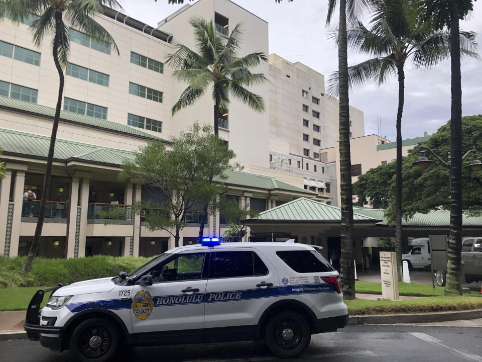 This photo shows the exterior of The Queen's Medical Center in Honolulu where some patients injured by air turbulence on a Hawaiian Airlines flight from Phoenix to Honolulu were taken, Sunday, Dec. 18, 2022. (AP Photo/Audrey McAvoy)