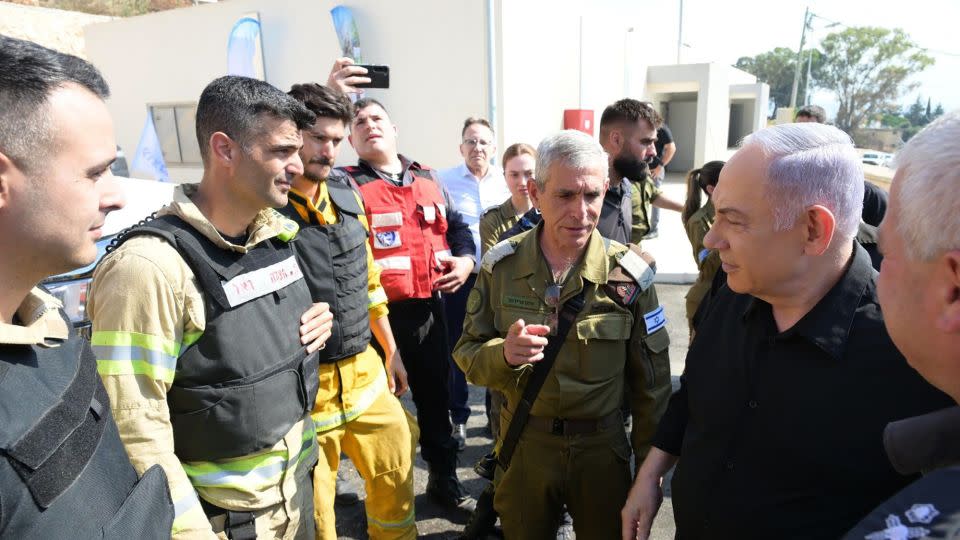 Israeli Prime Minister Benjamin Netanyahu visits Kiryat Shmona, a northern city near the Lebanese border, after large fires erupted in the area following rocket fire from southern Lebanon, on Wednesday. - GPO