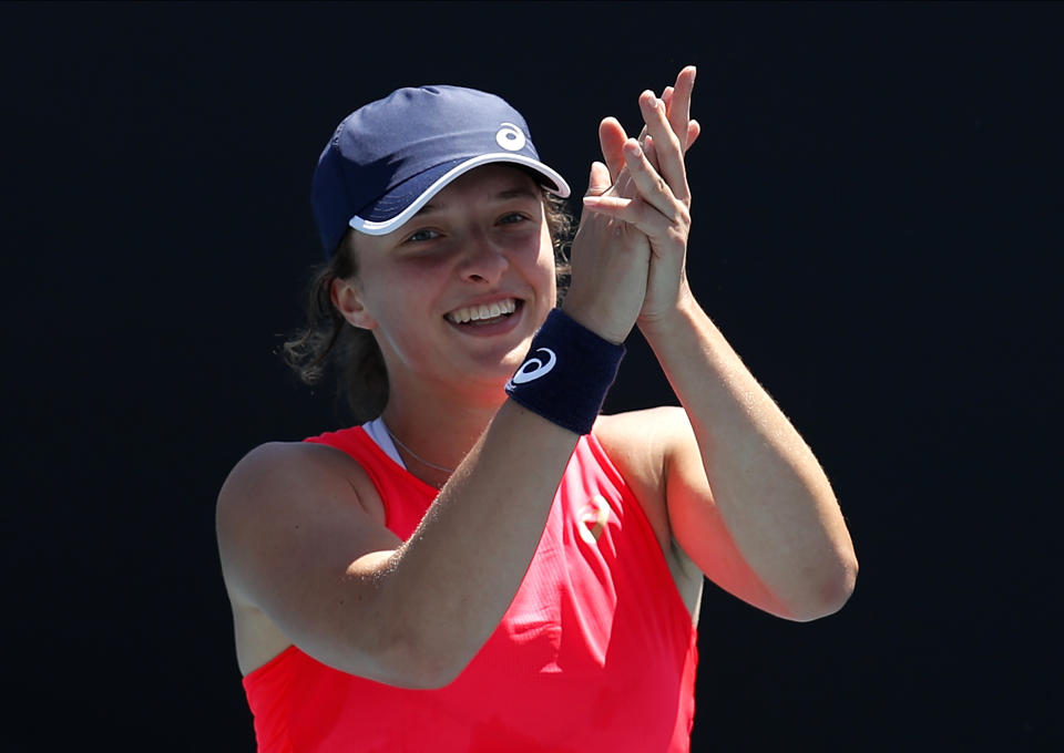 Poland's Iga Swiatek celebrates after defeating Croatia's Donna Vekic in their third round singles match at the Australian Open tennis championship in Melbourne, Australia, Saturday, Jan. 25, 2020. (AP Photo/Andy Wong)