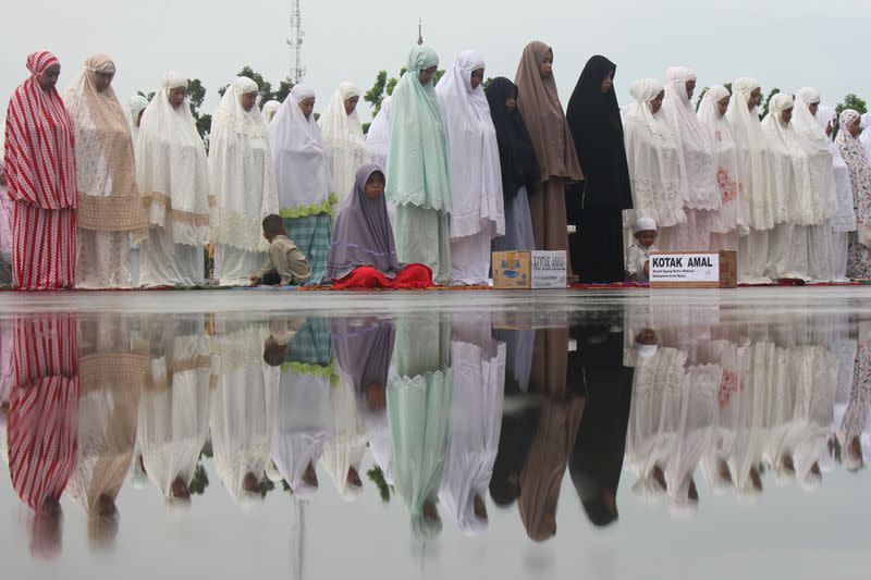 Indonesian Muslim women pray during Eid al-Fitr, the Muslim festival marking the end the holy fasting month of Ramadan, at a mosque in West Aceh