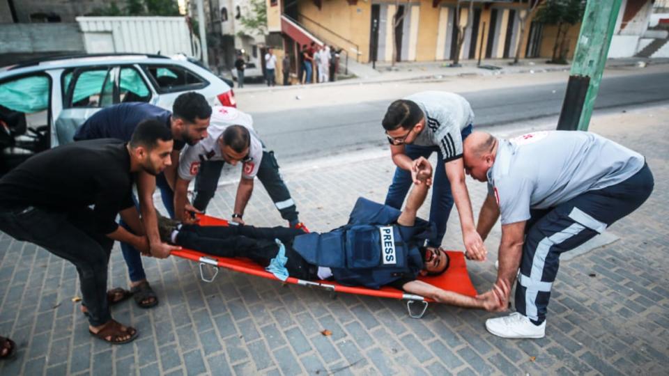 <div class="inline-image__title">1232871209</div> <div class="inline-image__caption"><p>Anadolu Agency's cameraman Mohammad al-Aloul is carried to hospital after being hit by an Israeli strike.</p></div> <div class="inline-image__credit">Mustafa Hassona/Anadolu Agency/Getty</div>