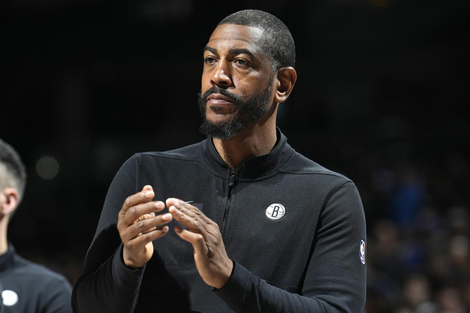 FILE - Brooklyn Nets assistant coach Kevin Ollie is shown during the first half of an NBA basketball game Thursday, Dec. 14, 2023, in Denver. Ollie, who led UConn to NCAA title a decade ago, has been named the interim head coach of the Brooklyn Nets. A day after firing Jacque Vaughn, the Nets announced Tuesday, Feb. 20, 2024, they were turning the team over to Ollie, who had been hired as an assistant coach ahead of this season.(AP Photo/David Zalubowski, File)