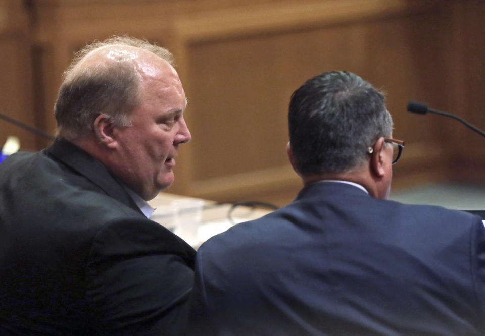 Former Wisconsin Supreme Court Justice Michael Gableman, left, an investigator hired by Republicans to look into former President Donald Trump's 2020 loss in the battleground state, talks with attorney Ronald Stadler, Friday, June 10, 2022, at the Dane County Courthouse in Madison, Wis. Gableman was found in contempt after he berated the judge and refused to answer any questions on the witness stand. (Amber Arnold/Wisconsin State Journal via AP)