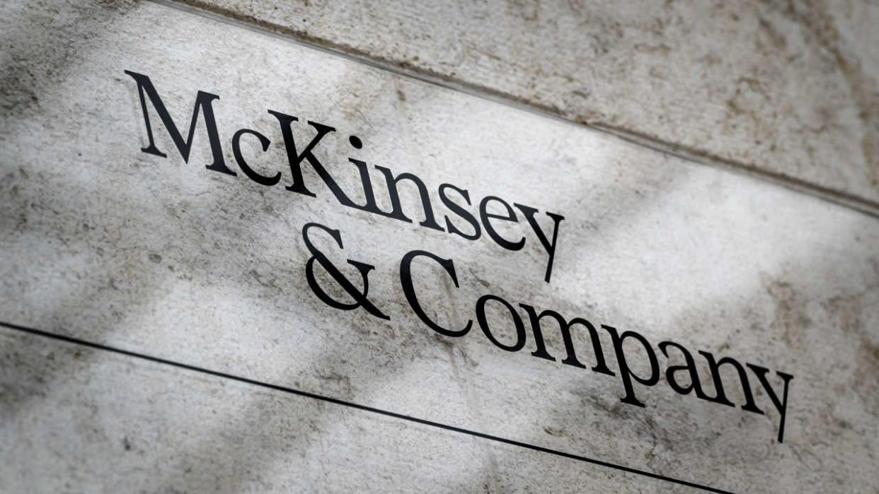 This photograph taken on April 12, 2022, shows a sign of US-based McKinsey & Company management consulting firm in Geneva. (Photo by Fabrice COFFRINI / AFP)