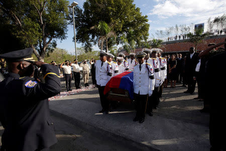 Members of the National Palace General Security Unit (USGPN) carry the coffin of Haiti's former President Rene Preval during the start of the acts for Preval's funeral in Port-au-Prince, Haiti, March 11, 2017. REUTERS/Andres Martinez Casares