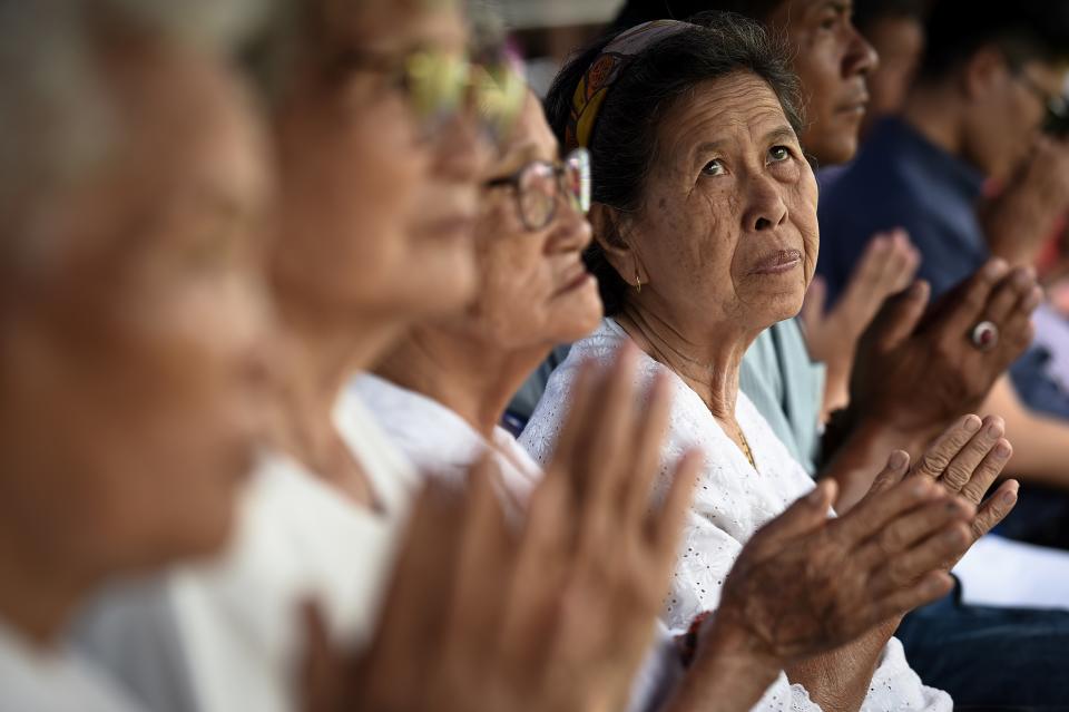 Local women attend a Buddhist prayer for the missing children at a school near Tham Luang cave at the Khun Nam Nang Non Forest Park in the Mae Sai district of Chiang Rai province on July 1, 2018.