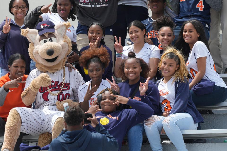 The Jackals mascot takes a photo with students form East Side High School. After years of neglect and abandonment Hinchliffe Stadium is being unveiled at a ribbon cutting in Paterson, NJ on Friday May 19, 2023. 