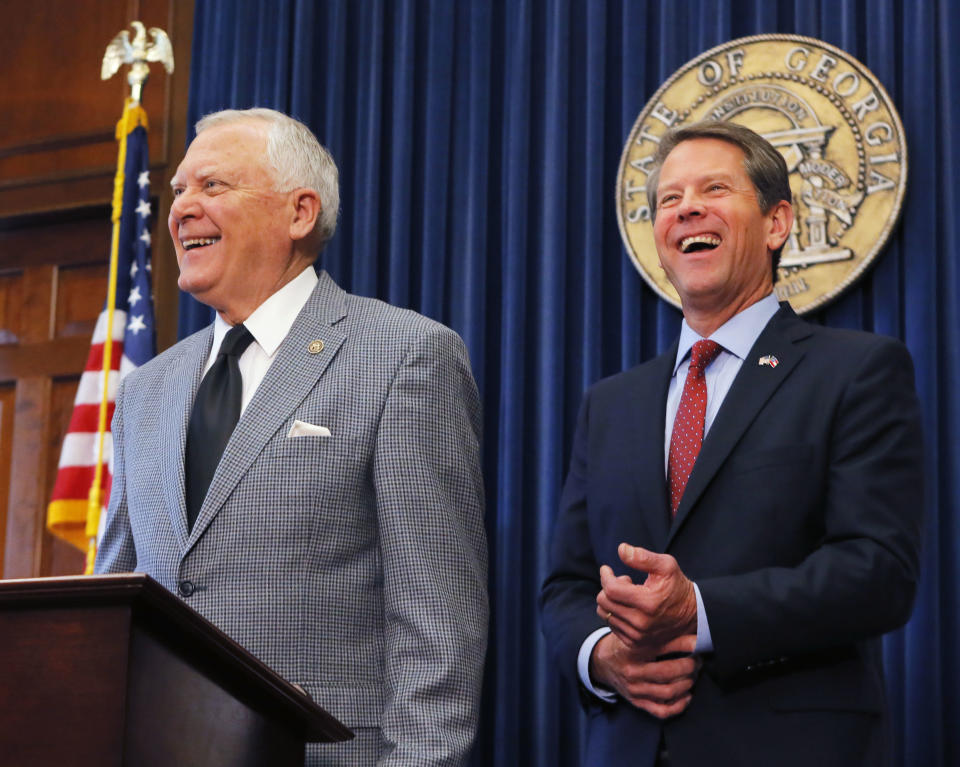 Republican Brian Kemp, right, and Georgia Gov. Nathan Deal hold a news conference in the Governor's ceremonial office at the Capitol on Thursday, Nov. 8, 2018, in Atlanta, Ga. Kemp resigned Thursday as Georgia's secretary of state, a day after his campaign said he's captured enough votes to become governor despite his rival's refusal to concede. (Bob Andres/Atlanta Journal-Constitution via AP)