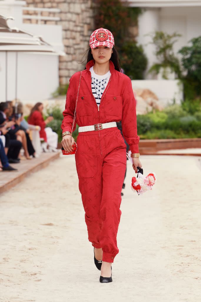 A tweed baseball cap and jumpsuit at Chanel Cruise 2022-2023. - Credit: Courtesy of Chanel