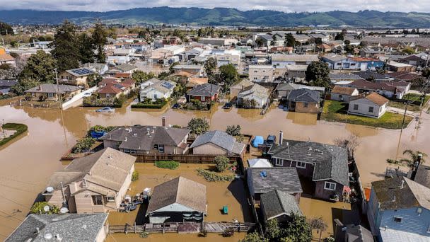 PHOTO: In this March 13, 2023, file photo, floodwaters surround homes and vehicles in the community of Pajaro in Monterey County, Calif. (Noah Berger/AP, FILE)