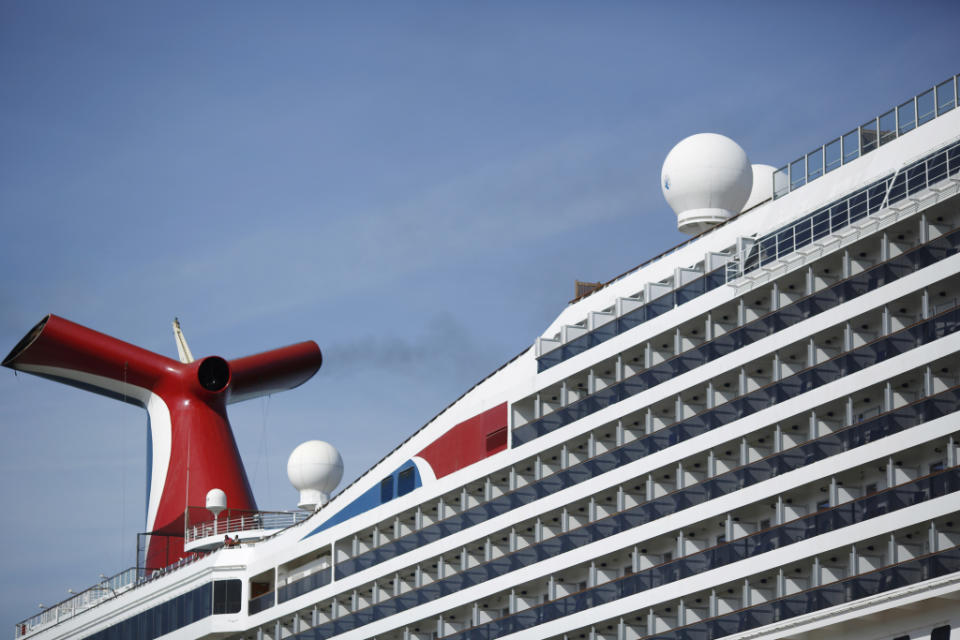 Citing fuel prices, the cruise company altered annual projections, causing stock to sink.