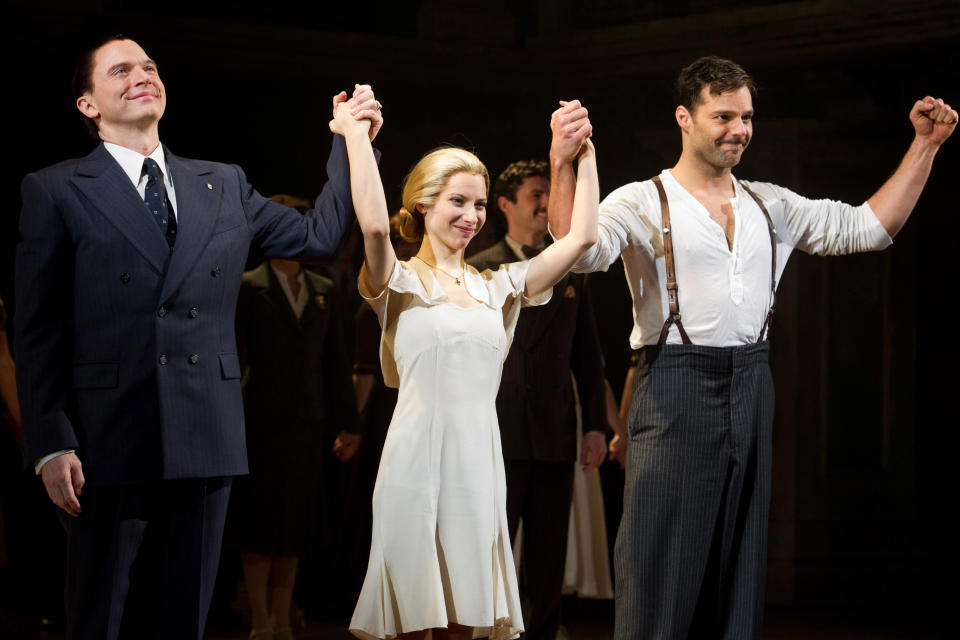 FILE - In this March 12, 2012 file photo, from left, Michael Cerveris, Elena Roger and Ricky Martin appear at the curtain call after their first performance in the new Broadway production of "Evita", in New York. (AP Photo/Charles Sykes)