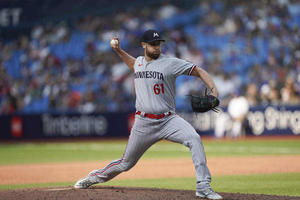 Minnesota Twins relief pitcher Brock Stewart (61) throws against the Toronto Blue Jays the during ninth inning of a baseball game, Saturday, June 10, 2023, in Toronto. (Arlyn McAdorey/The Canadian Press via AP)