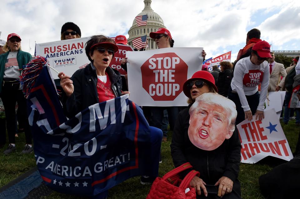 Supporters of President Donald Trump hold a 