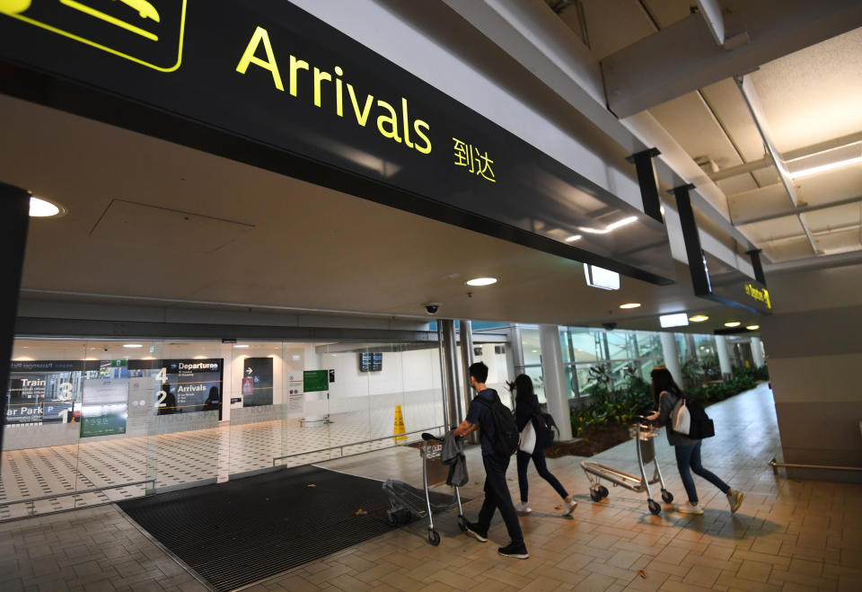 Passengers enter the International Airport in Brisbane, Saturday, December 12, 2020.