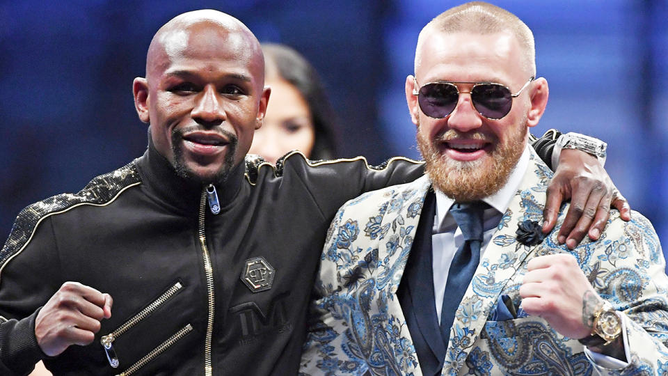 Floyd Mayweather Jr. is pictured alongside Conor McGregor prior to their 2017 boxing match.