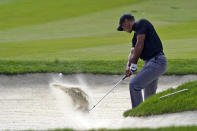 Tiger Woods hits from the bunker off the 13th fairway during the first round of the Zozo Championship golf tournament Thursday, Oct. 22, 2020, in Thousand Oaks, Calif. (AP Photo/Marcio Jose Sanchez)