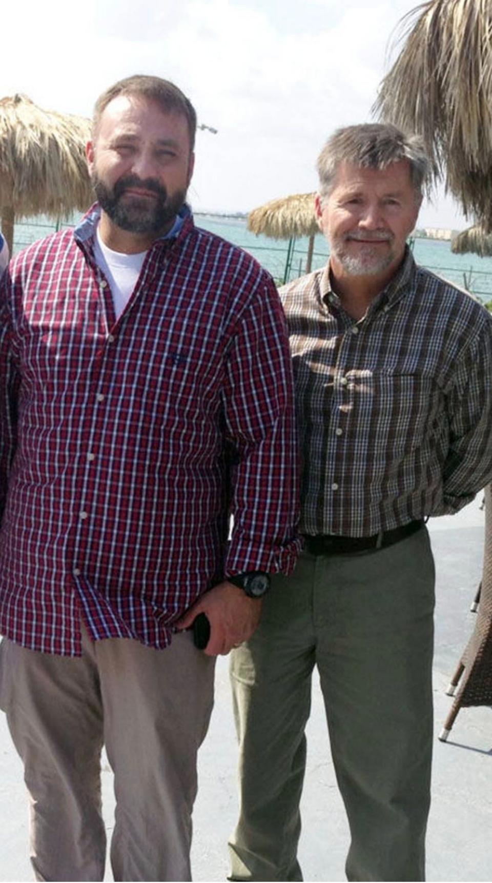 John Hamen III and Mark McAlister take a photo together in Djibouti before traveling to Yemen for their contract work. 