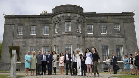 Britain's Prince Charles, Prince of Wales, and Camilla, Duchess of Cornwall, with owners Constance Cassidy and Eddie Walsh and family and friends including Timothy Knatchbull and wife Isabella, during a visit to Lissadell House May 20, 2015. REUTERS/Eddie Mulholland/Pool