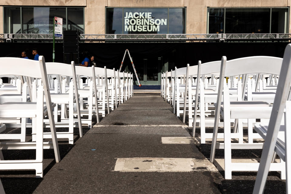 CORRECTS MONTH TO JULY, NOT JUNE - Chairs are set up outside the Jackie Robinson Museum, Tuesday, July 26, 2022, in New York. Long dreamed about and under construction for longer than the big league career of the man it honors, the Jackie Robinson Museum opened Tuesday in Manhattan with a gala ceremony attended by the 100-year-old wife of the barrier-breaking ballplayer and two of his children. (AP Photo/Julia Nikhinson)