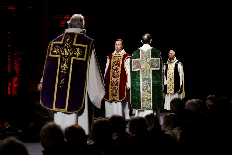 Volunteer models walk in around 30 religious garbs, some dating back to the 15th century, runway show at the Tournai cathedral, Belgium, November 10, 2021. Picture taken November 10, 2021.   REUTERS/Pascal Rossignol     TPX IMAGES OF THE DAY