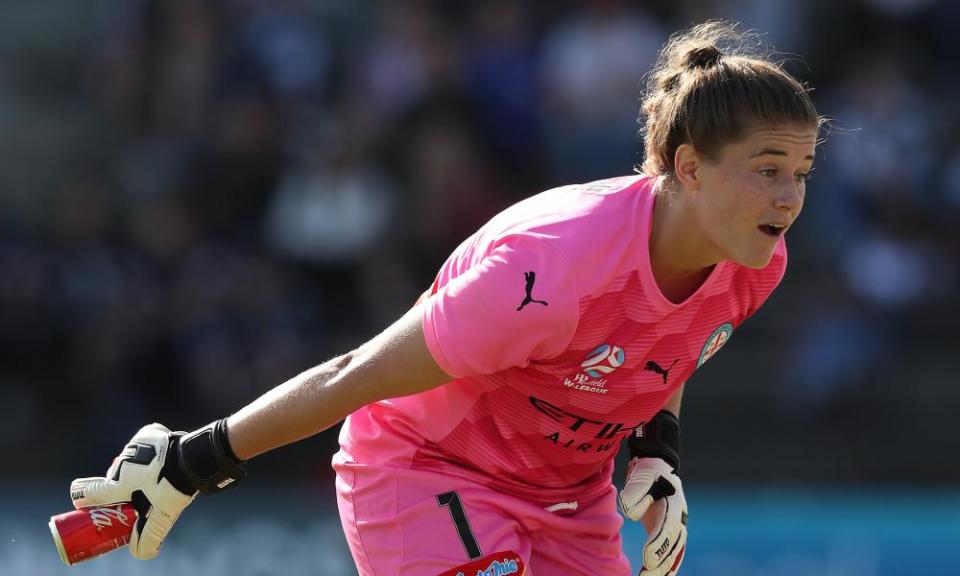 Melbourne City goalkeeper Teagan Micah removes a can thrown onto the pitch by Victory fans at the weekend