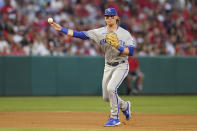 Kansas City Royals shortstop Bobby Witt Jr. (7) throws to first to out Los Angeles Angels' Andrew Velazquez during the third inning of a baseball game in Anaheim, Calif., Wednesday, June 22, 2022. (AP Photo/Ashley Landis)