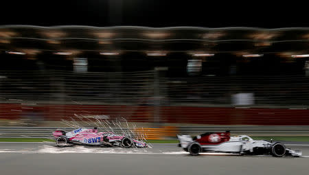 Formula 1 F1 - Bahrain Grand Prix - Bahrain International Circuit, Sakhir, Bahrain - April 8, 2018 Sauber's Marcus Ericsson and Force India's Sergio Perez in action during the race REUTERS/Hamad I Mohammed