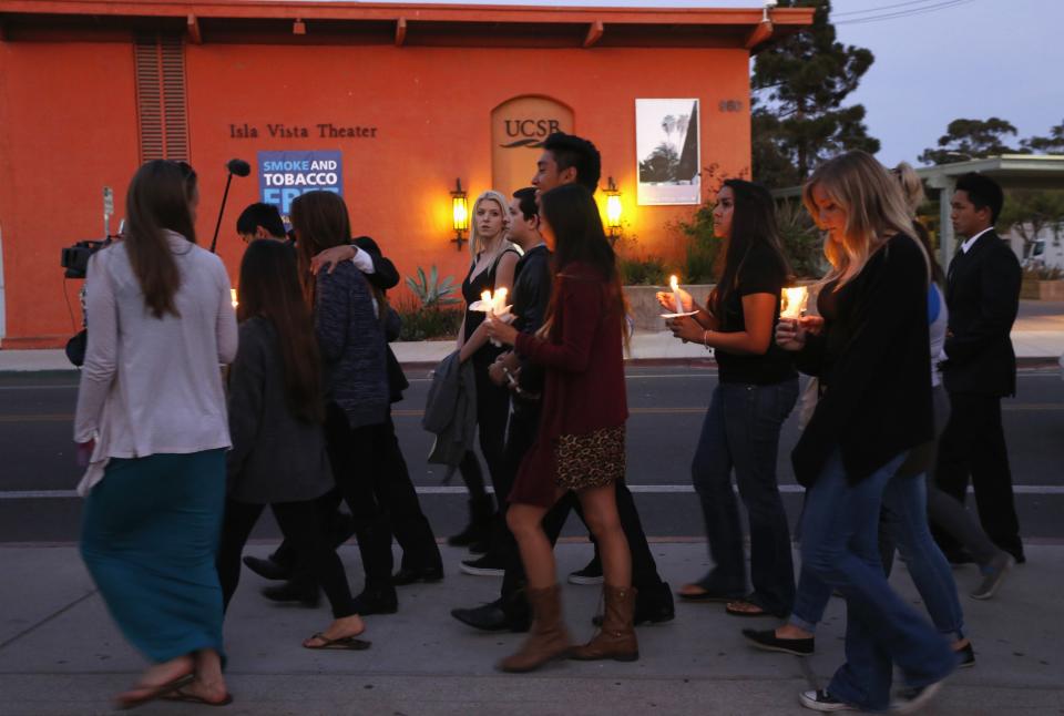 UC Santa Barbara students attend a candlelight vigil following Friday's series of drive-by shootings in Isla Vista