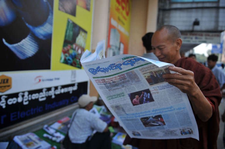 A Buddhist monk reads a copy of The Union daily newspaper in Yangon on April 1, 2013. Privately owned daily newspapers hit Myanmar's streets Monday for the first time in decades under new freedoms that represent a revolution for a media industry which was shackled under military rule
