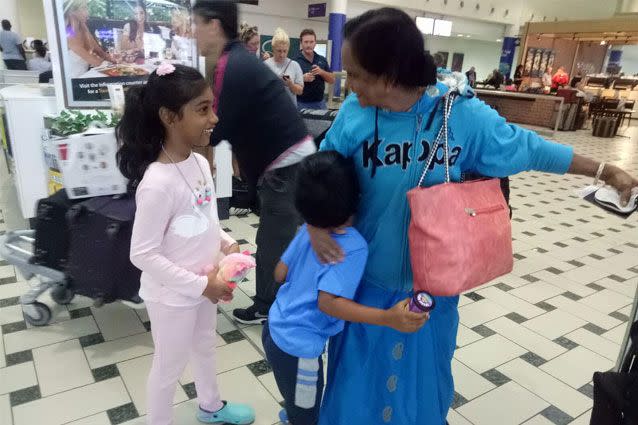 Ms Lakshmi's grandchildren were there to meet her at Brisbane Airport, ready to celebrate her 65th birthday. Source: Supplied