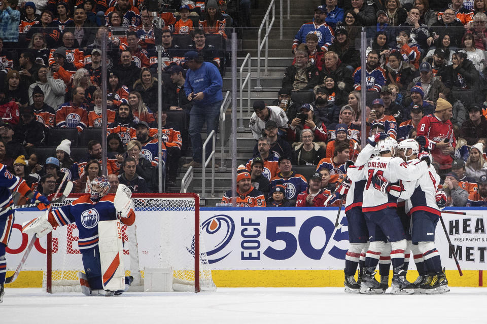 Washington Capitals celebrate a goal against the Edmonton Oilers during the second period of an NHL hockey game in Edmonton, Alberta, Monday, Dec. 5, 2022. (Jason Franson/The Canadian Press via AP)