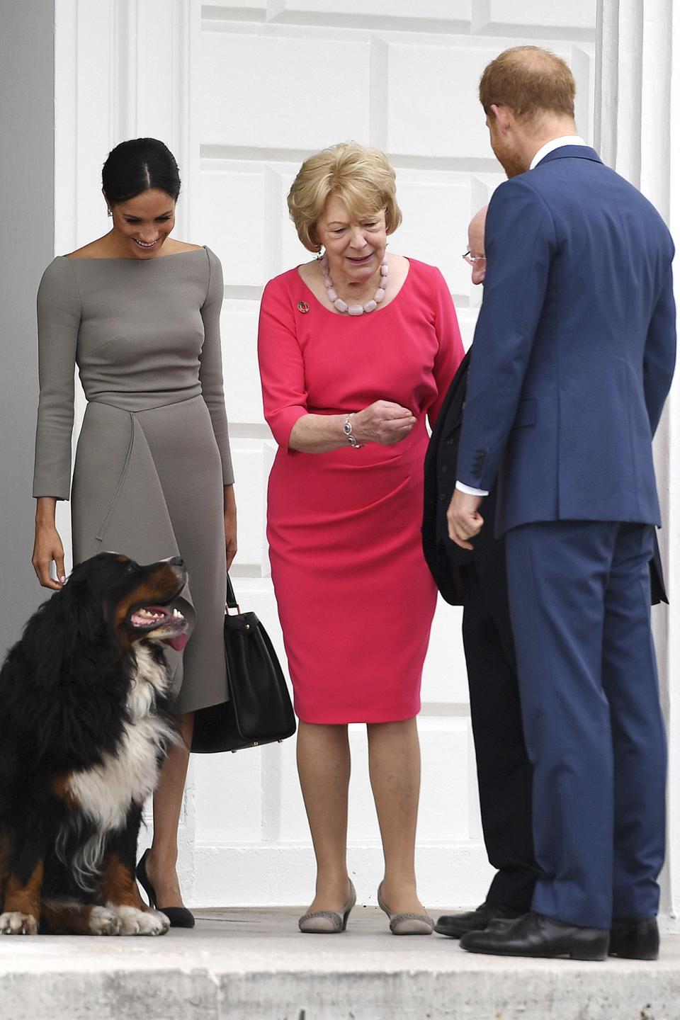 Meghan's animal attraction <a href="https://people.com/royals/meghan-markle-prince-harry-ireland-president-mountain-dogs/" rel="nofollow noopener" target="_blank" data-ylk="slk:was on full display;elm:context_link;itc:0;sec:content-canvas" class="link ">was on full display</a> in July 2018, when she joined Prince Harry on a trip to Ireland. During <a href="https://people.com/royals/meghan-markle-prince-harry-day-two-ireland/" rel="nofollow noopener" target="_blank" data-ylk="slk:the second day of the couple's royal tour;elm:context_link;itc:0;sec:content-canvas" class="link ">the second day of the couple's royal tour</a>, Meghan and Prince Harry met with President Michael Higgins and his wife Sabina at their official residence. The newlyweds were greeted by their hosts’ dogs, Brod, a male, and Sioda, a female, on a walk around the grounds. After the tour of the residence, the dogs really showed how much they enjoyed Meghan’s company. When the foursome walked to the garden, Brod and Sioda ran over to Meghan and Harry to be petted, barking at journalists along the way. The dogs stayed with them almost the whole visit — they were begging for attention from their visitors even as they said their farewells.