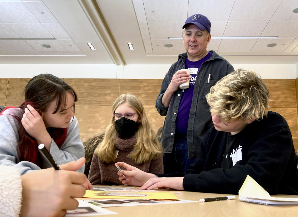 Ballard High School social studies teacher Shawn Lee watches over his students at MisinfoDay, an event hosted by the University of Washington to help high school students identify and avoid misinformation, Tuesday, March 14, 2023, in Seattle. Educators around the country are pushing for greater digital media literacy education. (AP Photo/Manuel Valdes)