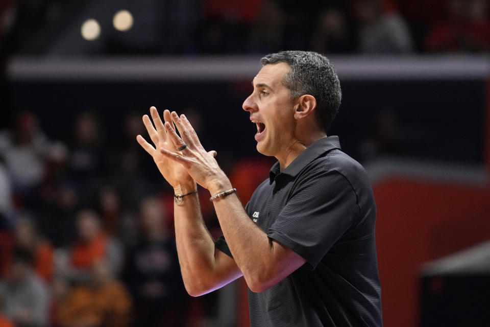 Colgate head coach Matt Langel directs his team during the second half of an NCAA college basketball game against Illinois Sunday, Dec. 17, 2023, in Champaign, Ill. Illinois won 74-57. (AP Photo/Charles Rex Arbogast)