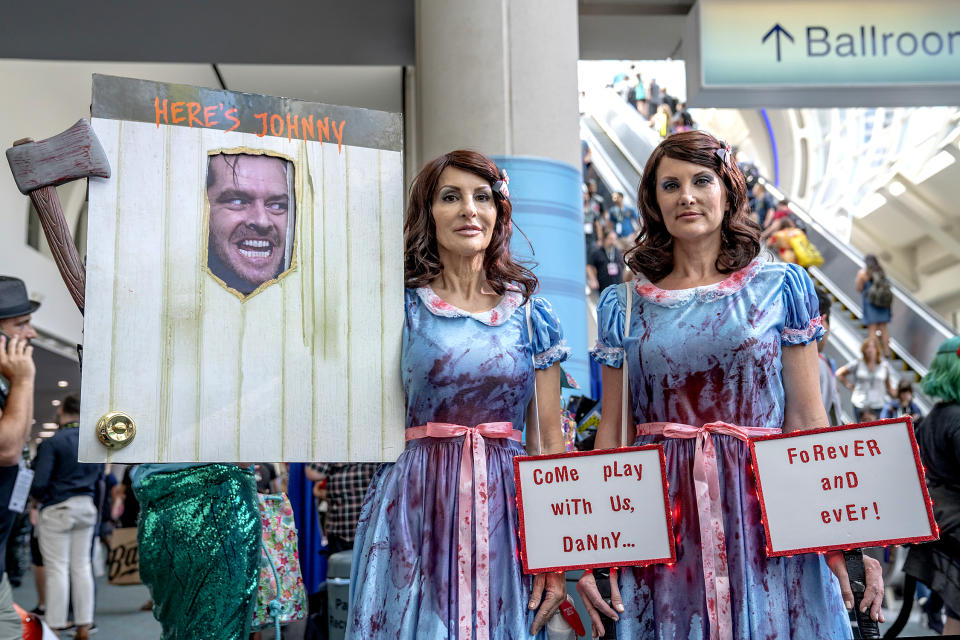 <p>Cosplayers dressed as <em>The Shining</em> twins at Comic-Con International on July 19, 2018, in San Diego. (Photo: Christy Radecic/Invision/AP) </p>