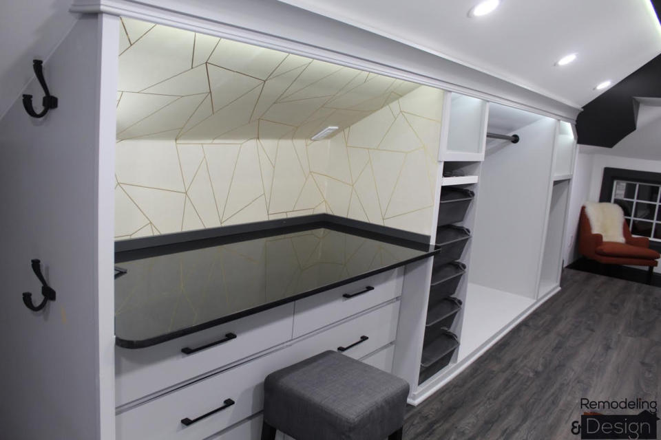 The space includes a vanity and floor-to-ceiling shoe rack.  (Courtesy Rodolfo Cabrera)