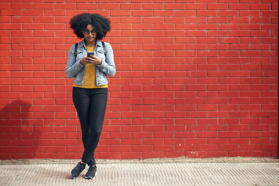 A woman looking at her phone