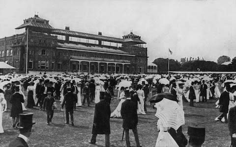 Spectators take the field at Lord's during the lunch break at the Eton versus Harrow cricket match in 1905 - six years after Trott's mighty drive - Credit: Hulton Archive/Getty Images